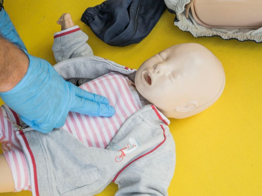 performing cpr to a child manikin