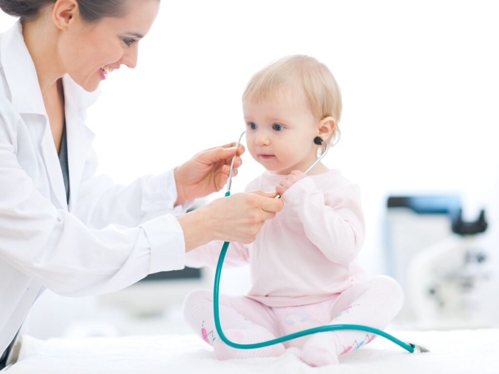 doctor listening to a baby's heartbeat
