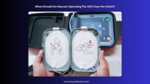 When Should the Rescuer Clear the Victim During AED Use?